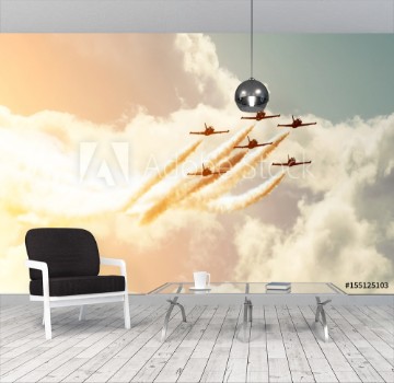 Bild på Aircraft fighter jets smoke the background of sky and sun